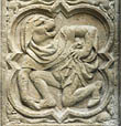 Panel 18:02 - Man with dog's head, holding his foot and looking backwards